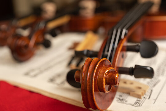 Violin on top of sheet music in a workshop