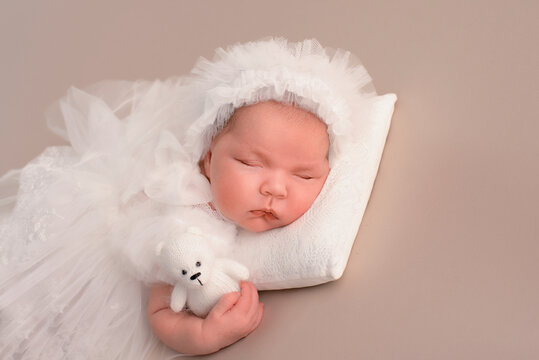 Lovely newborn resting on pillow. sleeping newborn baby girl