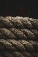 close up of a rope on a wooden background