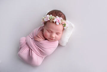 Lovely newborn resting on pillow. sleeping newborn baby girl