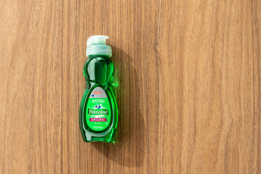 Colorado Springs, CO - July 6, 2022: Palmolive original formula dish liquid is provided in a 3 ounce bottle for hotel suite guests. Palmolive dish soap cuts grease and is also eco-friendly.