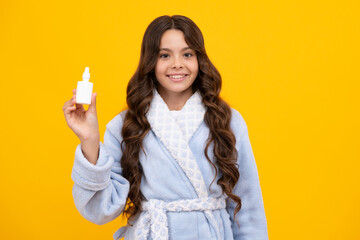 Runny nose. Teenager girl use nasal drops spray. Allergy, healthy child hold nasal drops.