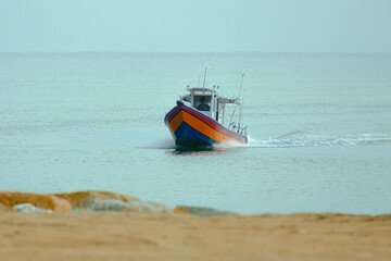 Naklejka premium Coast scenery with a fisherman boat in Cherok Paloh, Pahang, Malaysia