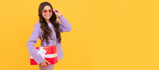 sale and discount. surprise for her. boxing day. cheerful kid with present box. Kid girl with gift, horizontal poster. Banner header with copy space.