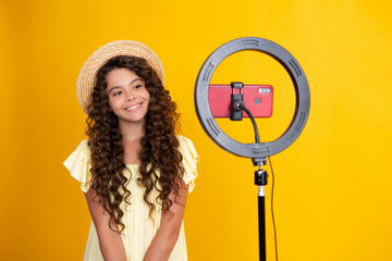Teenager blogger making video, child vlogger influencer record content. Child blogger records video...