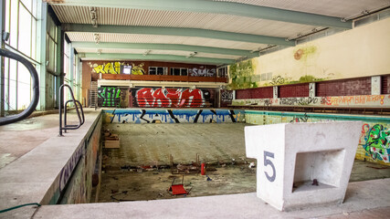 Views into an old abandoned swimming pool