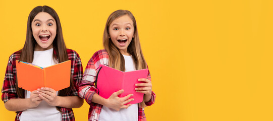 School girls friends. amazed kids in casual checkered shirt having fun reding books, amazement. Portrait of schoolgirl student, studio banner header. School child face, copyspace.