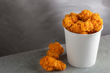 Crispy fried chicken in the bucket. Chicken bucket.