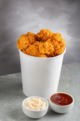 Crispy fried chicken in the bucket. Chicken bucket.