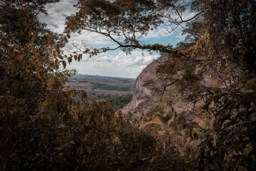 Brazilian landscape with a rocky waterfall and trees 