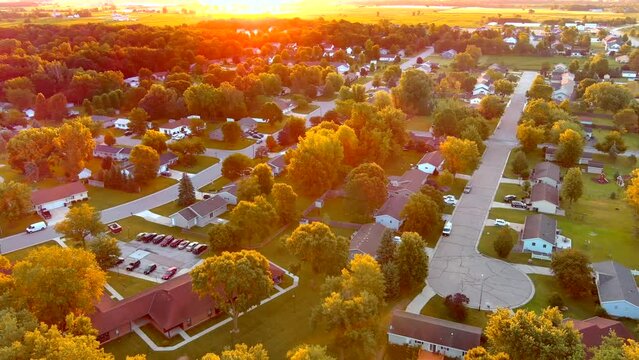 Sunrise flyover of scenic small town America.