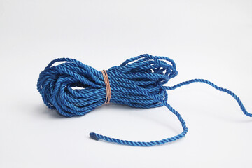 Blue plastic rope reel with isolated white background