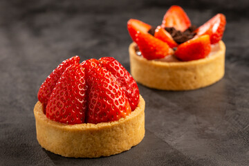 Tasty strawberry tartlet on the table.