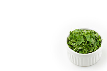 Parsley sliced ​​in ramekin isolated on white background.