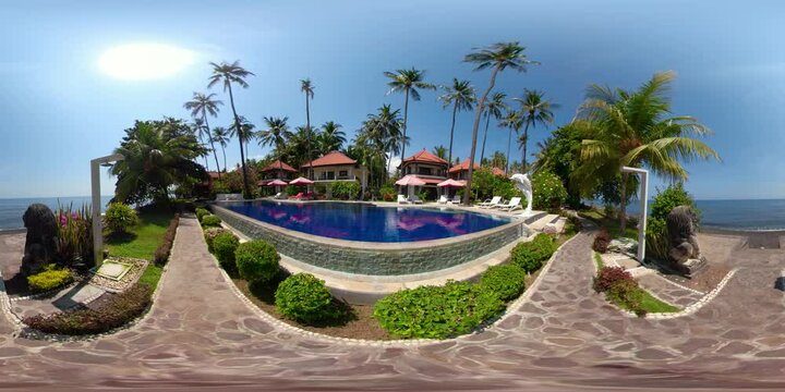 vr360 swimming pool in luxury hotel with sun beds by sea. tropical resort with pool. Travel concept.