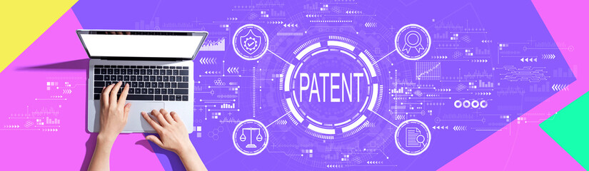 Obraz na płótnie Canvas Patent concept with person using a laptop