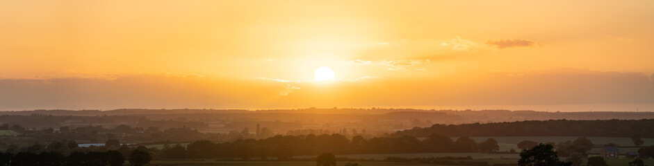 Sunset panorama over east midlands fields near Milton Keynes. Buckinghamshire. United Kingdom landscape