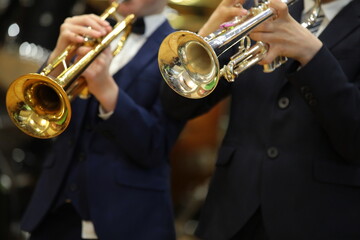 Musician playing the trumpet in the orchestra close-up selective focus