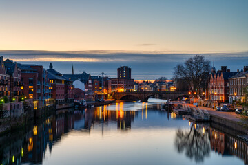 Fototapeta na wymiar The city of York in England with Ouse river canal at sunset