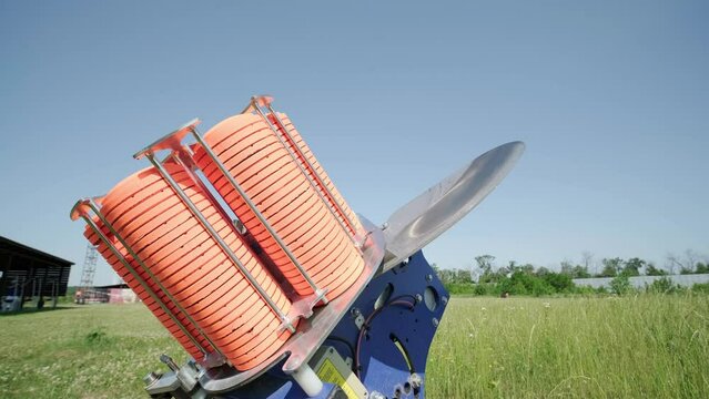 Slow Motion Clay Pigeon from the Side. Bench shooting on plates. V-log Bench shooting on plates. Automatic machine for throwing plates for shooting. Throwing machine for bench shooting.