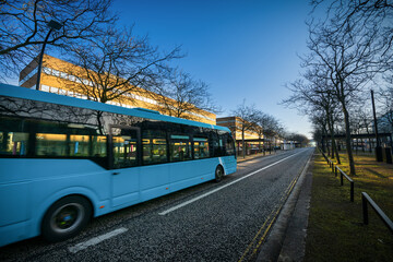 Midsummer boulevard with blurry bus in mortion in morning light in Milton Keynes. England