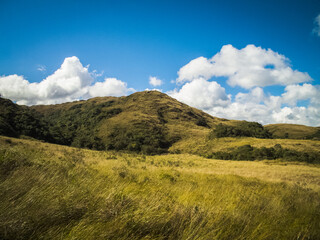 Landscape with blue sky and clouds.