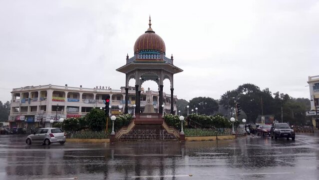 The Iconic Krishnaraja wodeyar Maharaja memorial circle in the Mysore cityscape on a rainy day during Monsoon in Karnataka, India.