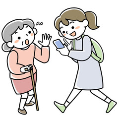 歩きスマホをする若者とぶつかりそうになって驚くシニア女性