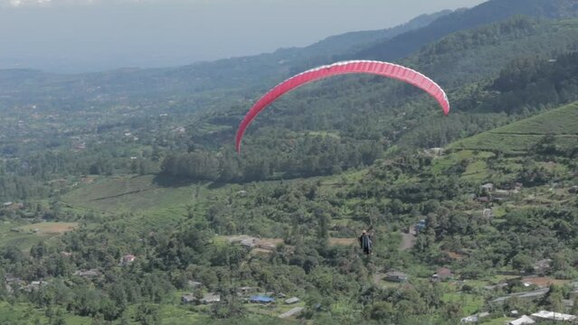 Paragliding Recreational Competitive Adventure Sport of Flying Paragliders from Hilltop in Puncak Cisarua Bogor, Indonesia