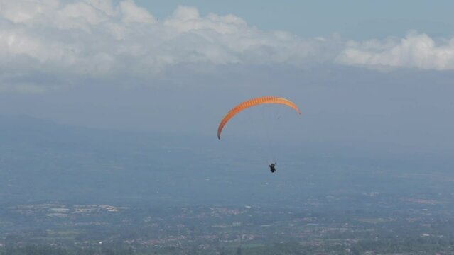 Paragliding Recreational Competitive Adventure Sport of Flying Paragliders from Hilltop in Puncak Cisarua Bogor, Indonesia