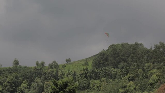 Paragliding Recreational Competitive Adventure Sport of Flying Paragliders from Hilltop in Puncak Cisarua Bogor, Indonesia