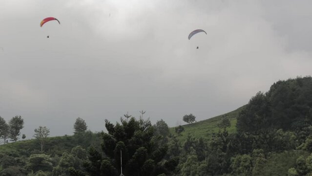 Paragliding Recreational Competitive Adventure Sport of Flying Paragliders from Hilltop in Puncak Cisarua Bogor, Indonesia