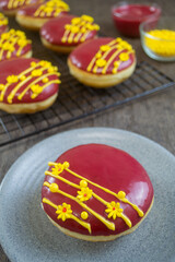 red velvet donuts or donat red velvet, the taste is sweet and savory combined with red velvet glaze that melts in the mouth