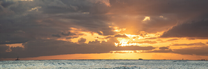 Panoramic landscape of Waikiki Beach at sunset on Oahu, Honolulu, Hawaii.