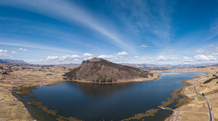 Aerial view of Huaypo Lake. Water source in the high Andes of Cusco Peru. Sunny day in Andean rural...