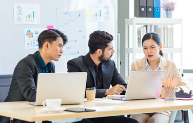 Group of millennial Asian Indian multinational multicultural male and female businessman businesswoman teamwork in formal suit sitting smiling brainstorming meeting together in office conference room