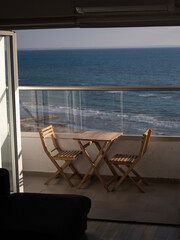 Cozy place at the balcony with sea background