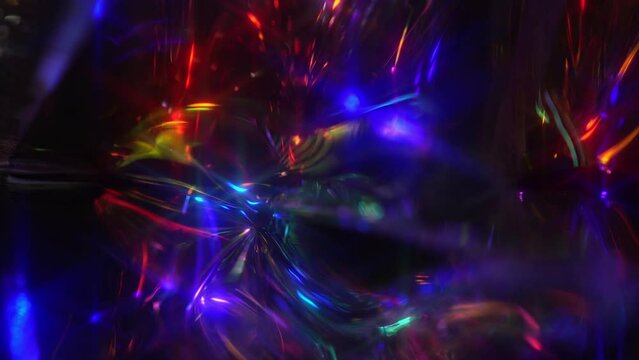 Light rays through a crystal prism. Light leaks. Festive neon abstract holographic modern background for party