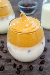 Kopi dalgona or dalgona coffee.made by mixing instant coffee, sugar, and hot water then whipped until it becomes creamy and then added to cold or hot milk