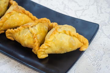 pastel pisang coklat, a snack containing bananas and chocolate cooked by frying. It has a crunchy texture.