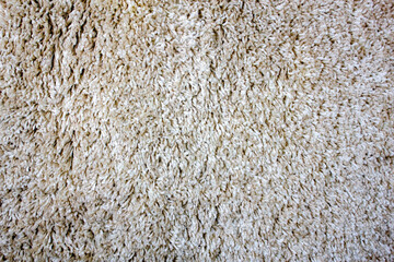 Carpet pile detail. Shaggy soft floor carpet close-up background high definition texture.