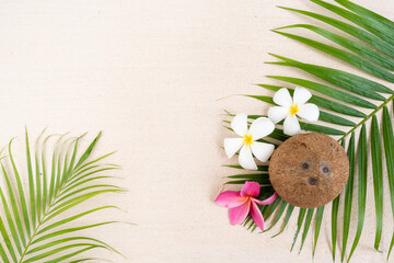 Fototapeta na wymiar Coconut on palm leaf at the beach.
