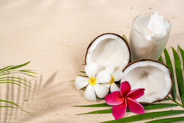 Fototapeta na wymiar Coconut drink and coconut fruit on sand background.
