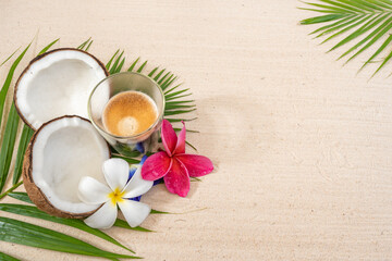 Cup coffee  with crema on palm leaf background.