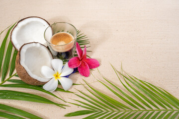 Fototapeta na wymiar Cup coffee with crema on palm leaf background.