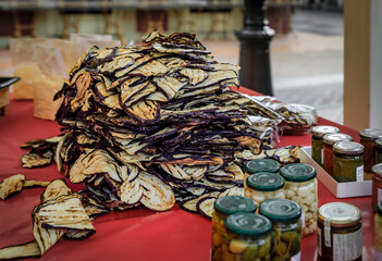 A heap of fresh locally grown dried grilled eggplant for sale at a local outdoor farmers market in Nice, French Riviera, South of France