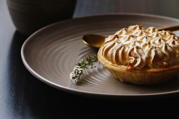 Lemon meringue dessert fresh off a bakery