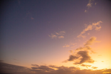 Sunset sky replacement for photo editing with dramatic clouds, purple and orange tones. 