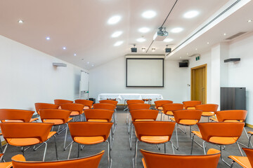 Interior of a room for presentations full of chairs