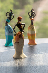 Imitation of ritual African dances. Picturesque figurines of African countries. Ceremonial...